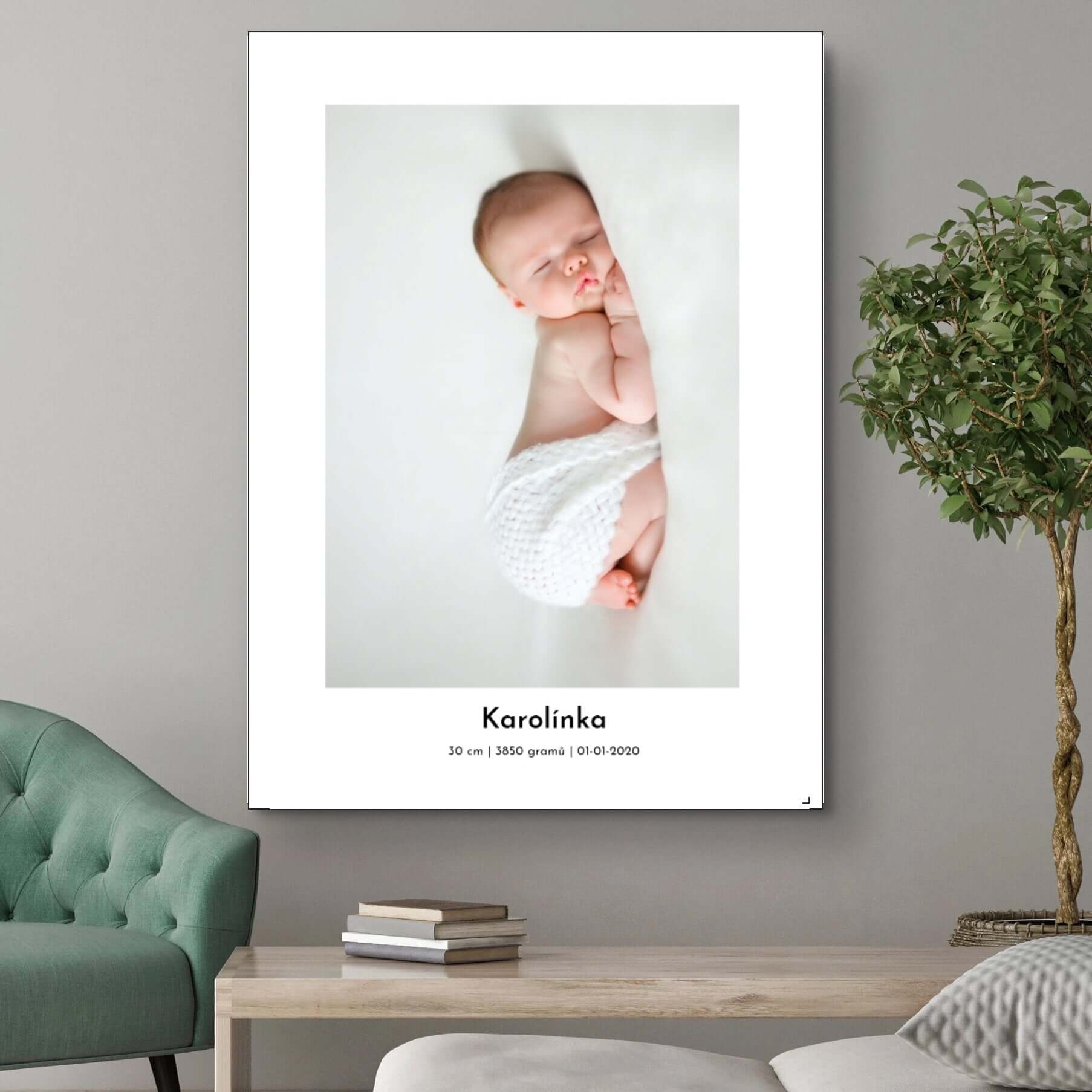 Personalized baby canvas print with photo and birth details on wall, featuring sleeping newborn in white blanket.